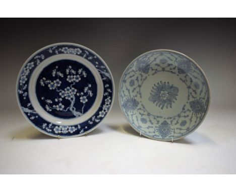 A Chinese circular dish, painted in tones of blue and white with blossoming prunus on a ground of cracked ice, 27cm diam, six