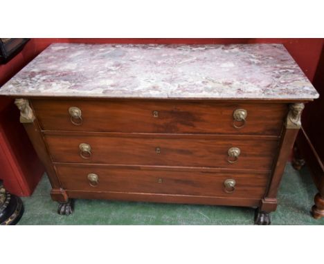 A 19th century mahogany commode, in the manner of Bernard Molitor, rectangular marble top above three long drawers flanked by