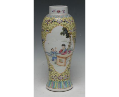 A Chinese slender baluster vase, painted in polychrome with a lady and boy attendant, on a yellow ground, 28cm high, red seal