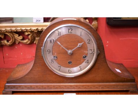 A 1930's oak cased Napoleon hat mantel clock with Westminster chime