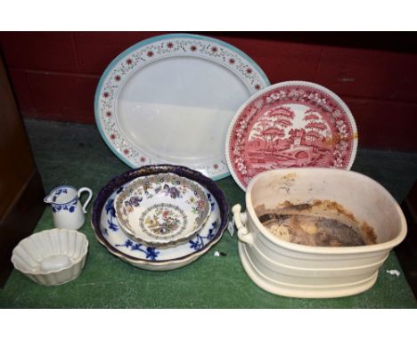 A Staffordshire two handled footman; a large Royal Worcester meat plate; a blue and white washbowl; etc