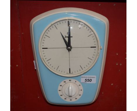 A 1950's Junghans ceramic kitchen clock, with timer