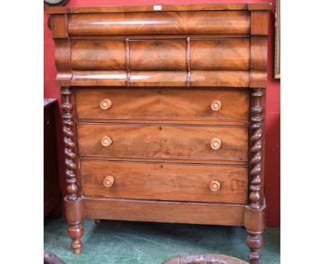 A Victorian flame mahogany Scotch chest, hipped rectangular top above one long and three short serpentine drawers, the base w