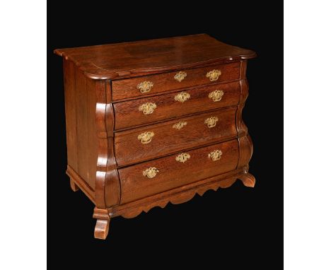 A Dutch colonial palmwood bombe shaped commode, moulded top above four long graduated drawers, shaped apron, canted angles, b