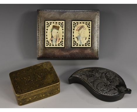 A late 19th century Indian Bidriware leaf-shaped snuff box, the sliding cover inlaid with silver foliage within a cell border