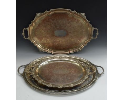An EPNS oval serving tray, plain field, fluted border, acanthus handles, 71cm wide, William Hutton &amp; Sons, early 20th cen