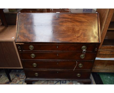 A 19th century mahogany bureau, fall front enclosing a central small door flanked by secret compartments and an arrangement o