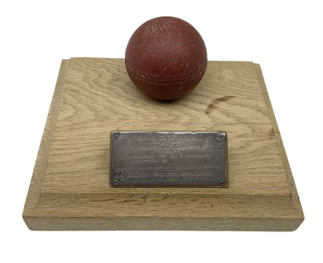 Raich Carter - early school cricket trophy of a cricket ball mounted on an oak base with white metal plaque inscribed 'Swan C