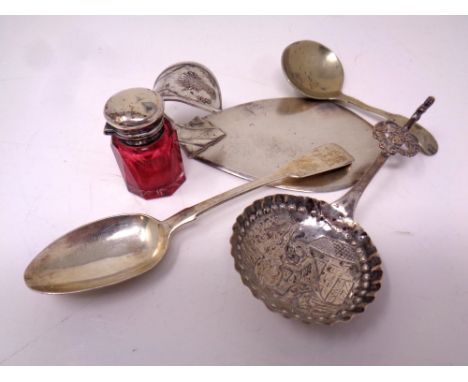 A small silver topped ruby glass jar together with three pieces of silver cutlery and a further plated caddy spoon.