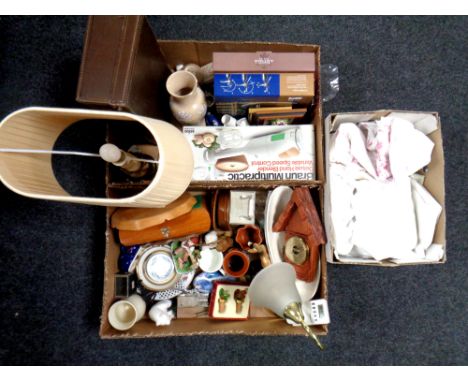 Three boxes containing miscellanea to include boxed wine corkscrew set, cheese board and knife set, mantel clock, table lamps