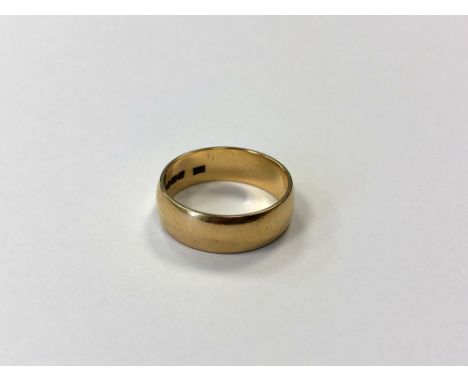 An 18ct gold band ring, size M CONDITION REPORT: 4.7g