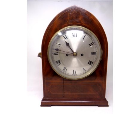 A 19th century inlaid mahogany arch topped mantel clock by J M.Adams of Dumfries with double fusee movement, silvered dial an