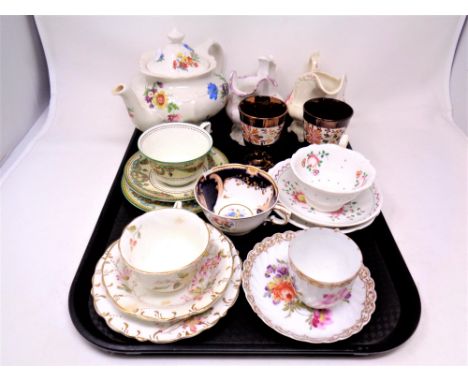 A tray containing a Saddler teapot, pair of copper lustre goblets, antique and later tea cups and saucers