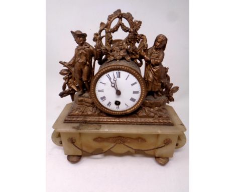 An antique continental spelter and marble mantel clock