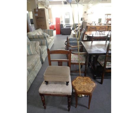 An Edwardian mahogany dining chair together with a footstool, a musical occasional table and a two-way floor lamp 