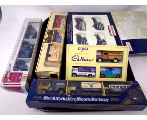 A tray containing five Corgi and Lledo die cast box set to include North Yorkshire Moors Railways, Cadburys collection, Pickf