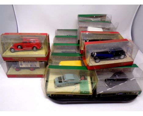 A tray containing twelve Corgi Classics die cast models together with four further Matchbox Models of Yesteryear (boxed)