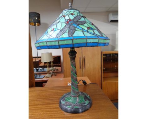 A contemporary Tiffany style table lamp decorated with dragonflies