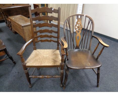 An oak ladder back rush seated chair together with a wheel back chair 