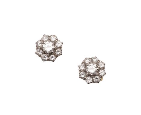 A PAIR OF DIAMOND CLUSTER STUD EARRINGS. A PAIR OF DIAMOND CLUSTER STUD EARRINGS. each earring set with a circular-cut diamon