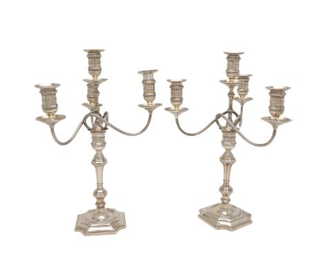 A PAIR OF GEORGE V SILVER FOUR-LIGHT CANDELABRA. A PAIR OF GEORGE V SILVER FOUR-LIGHT CANDELABRA. on square bases with incurv