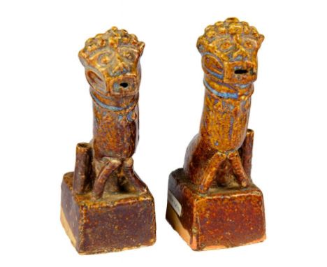 A PAIR OF CHINESE FLAMBÉ GLAZED EARTHENWARE DOG OF FO JOSS STICK HOLDERS, MING DYNASTY, 16/17TH C  the predominately brown gl