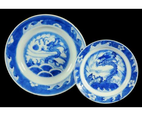 A CHINESE BLUE AND WHITE SMALL PLATE, KANGXI AND A CHINESE BLUE AND WHITE PLATE, C1770  painted with leaping carp and dragon,