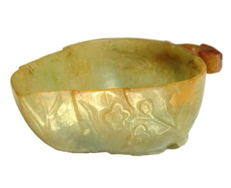 A CHINESE JADE BRUSH WASHER IN THE FORM OF A LEAF, 19TH C  the russet coloured stalk forming the handle, the exterior and und