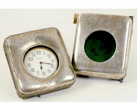 TWO SILVER MOUNTED LEATHER TRAVELLING CLOCK CASES, ONE CONTAINING A BRASS 'MAMMOTH' WATCH WITH ENAMEL DIAL