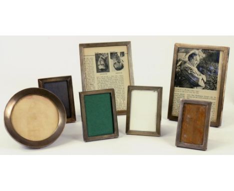 ONE CIRCULAR AND SIX RECTANGULAR SILVER PHOTOGRAPH FRAMES, ENGINE TURNED, VARIOUS MAKERS AND DATES