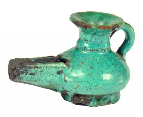 A PERSIAN TURQUOISE GLAZED POTTERY LAMP, 16TH-18TH C  6.6cm h ++ Minor old chipping around the rim but no substantial faults 