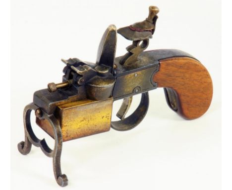 AN ALFRED DUNHILL BRASS TINDER PISTOL WITH WALNUT STOCK, CIRCA 1930'S