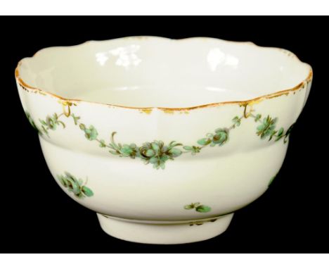 A BRISTOL OGEE SLOP BASIN, C1775-78 painted in green monochrome with swags, 14.5cm diam, blue enamel cross and gilder's numer