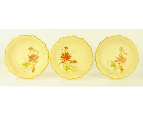 A SET OF THREE ROYAL WORCESTER SHELL MOULDED DESSERT PLATES DECORATED WITH FLOWERS ON A SHADED APRICOT GROUND, LATE 19TH CENT