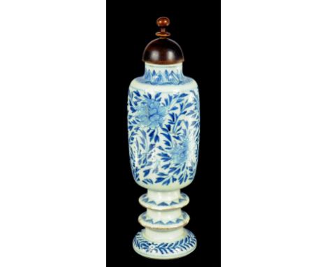 A CHINESE BLUE AND WHITE CYLINDRICAL VASE, KANGXI  on double knopped foot, painted with peonies, 18cm h, Holtzapfel Collectio