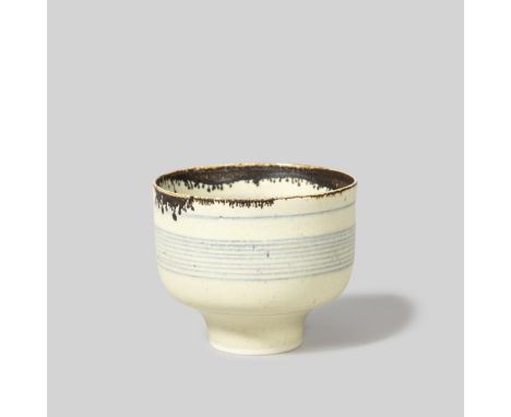 Lucie RieFooted bowl, circa 1979Porcelain, matt white glaze over concentric inlaid blue lines repeated inside and out, drippi