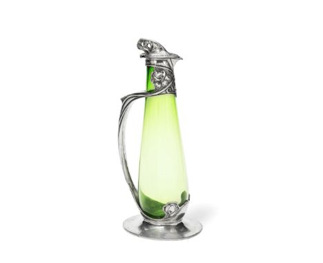 Liberty &amp; Co.'Tudric' claret jug, circa 1903 Pewter, glass. 35.3 cm highPewter produced by W.H. Haseler, Birmingham for L