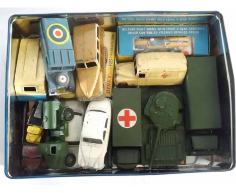 Tin containing mixed die-cast toys to include three Dinky toy military models to include a 10-tonne Army truck model number 6