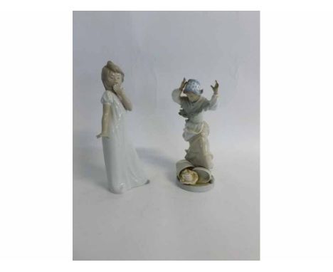 Nao figure of a young girl together with a further Spanish figure, 29 and 26cms high (2) 