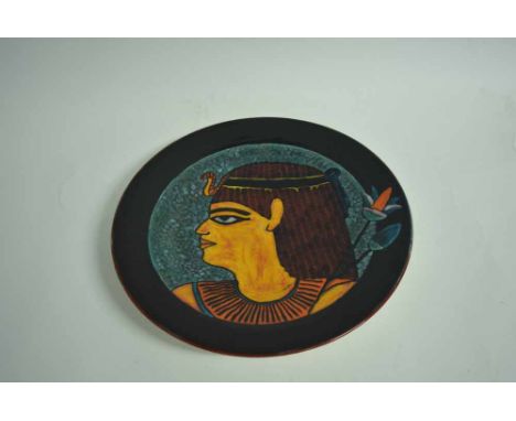 Poole Studio circular charger, the centre painted with an Egyptian head, 16cms diam 
