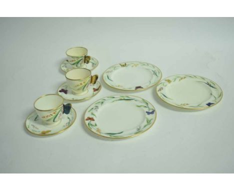 19th century English part tea service, cups with butterfly handles, the items all moulded, painted and decorated in colours w