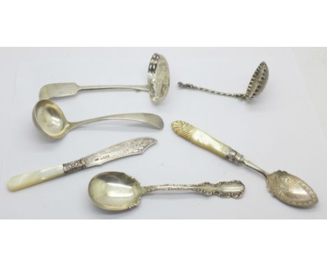Two 19th Century silver sifters, two silver and mother of pearl servers, a 925 silver spoon and a silver ladle, total weight 