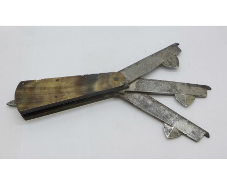 A horn mounted triple blade fleam/bloodletting tool, by Joseph Rodgers &amp; Sons, with a pair of tweezers set in the handle 