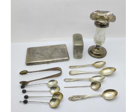 A collection of silver spoons and a pair of silver sugar bows, 97g, a cigarette case with an inscription relating to 4 Compan