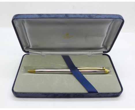 A cased Mikimoto International roller ball pen with pearl top 