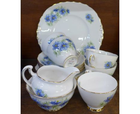 A Colclough tea service, five cups, one a/f, five saucers, six side plates, sugar, cream and a cake plate 
