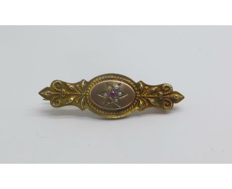 A 9ct gold, ruby and seed pearl brooch, 2.1g, lacking one pearl 