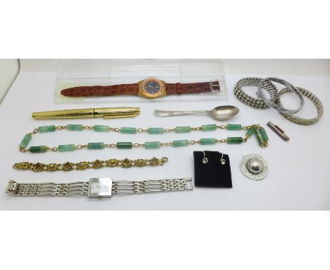 A Swatch wristwatch, one other watch, a vintage stone necklace, a white metal brooch, a railway badge, vintage screw back ear