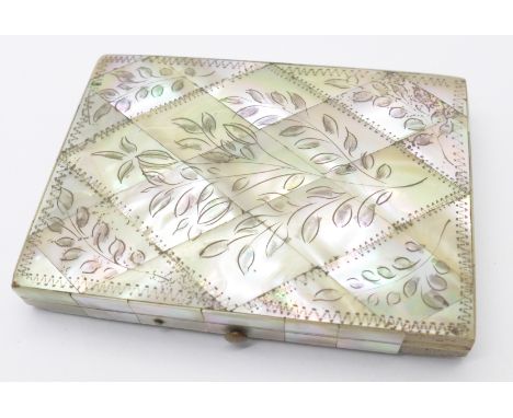 A decorated mother of pearl card case, 76mm x 105mm, (a/f, lacking two pieces of mother of pearl, one corner chipped) 