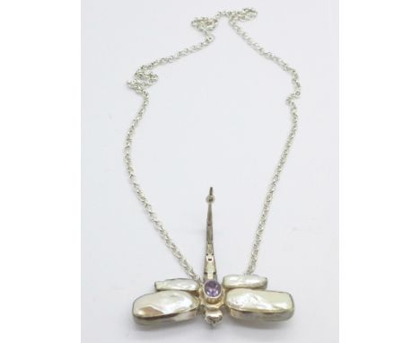 A silver, amethyst and blister pearl dragonfly pendant and chain 